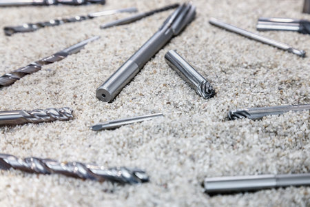 different drills are scattered on a light backgroundの写真素材