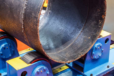 large diameter metal pipe on a welded table