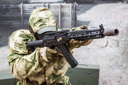 mannequin of a soldier with modern weapons