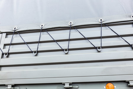 attaching the awning to the car body on a militaryの写真素材