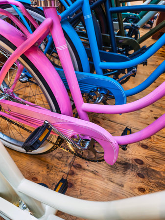 Colorful bicycles in a row showcasing vibrant hues and unique designs in a cheerful displayの写真素材
