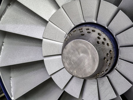 Close-up view of an aircraft jet engine turbine showcasing its intricate design and engineeringの写真素材