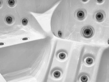 Details of a modern spa hot tub with massage jets captured in a minimalist styleの写真素材