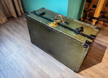 Vintage travel trunk on display in a cozy interior space with natural lightの写真素材