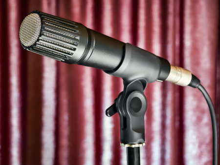 High-quality microphone ready for a live performance at a music venue in the eveningの写真素材