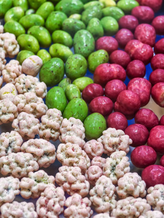 Colorful assortment of snacks displayed for a festive gathering at a local market in the afternoonの写真素材