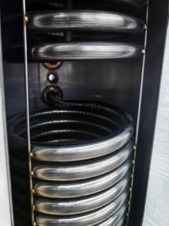 Close-up view of sleek coil system in modern applianceの写真素材