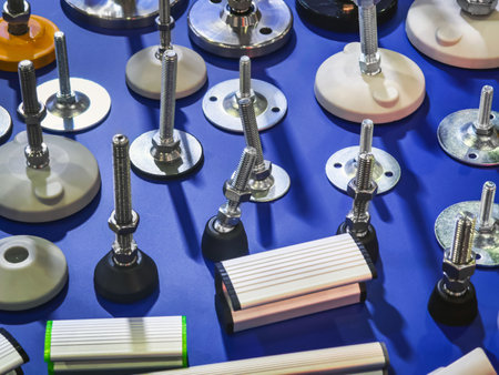 Various mechanical components displayed on a blue surface for industrial applications and engineering purposesの写真素材