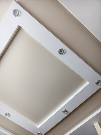 Modern interior design featuring a stylish ceiling with recessed lighting in a contemporary spaceの写真素材