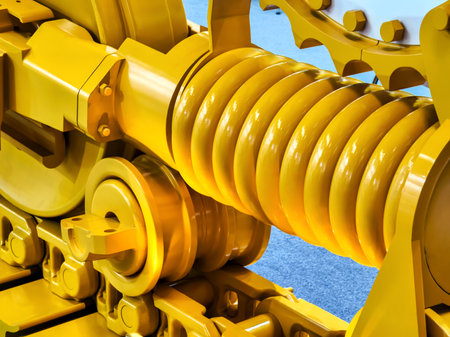 Detailed depiction of tractor tracks featuring bright yellow metal components.