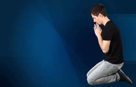 Praying, Kneeling, Teenager.の写真素材