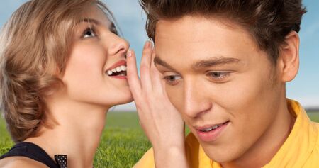 Whispering.