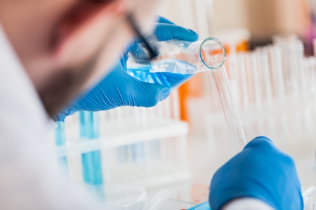 Man researcher carrying out scientific research.