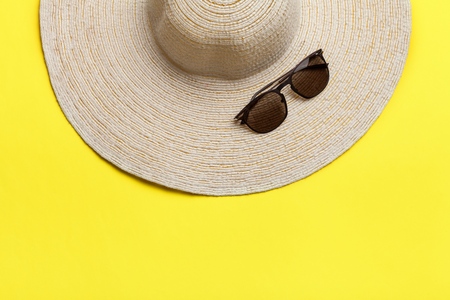 Straw beach womans hat sun glasses.