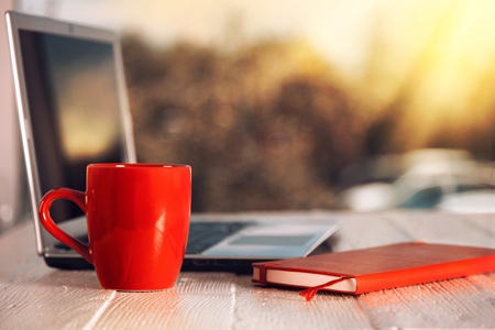 Morning coffee or tea cup at business office background.の写真素材