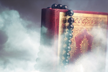 Islamic Book Koran with rosary on grey backgroundの写真素材