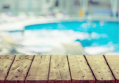 Table near the pool at sunny vacation dayの写真素材