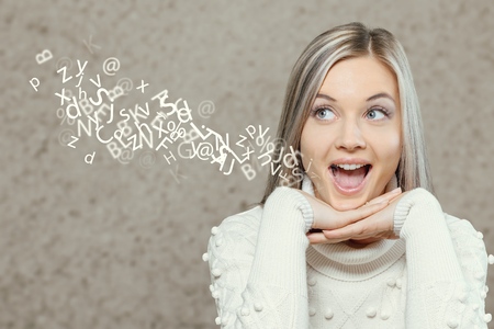 Woman talking with alphabet letters.の写真素材