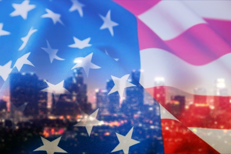 American flag on city background.の写真素材
