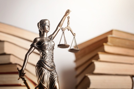 Statue of justice and book.の写真素材