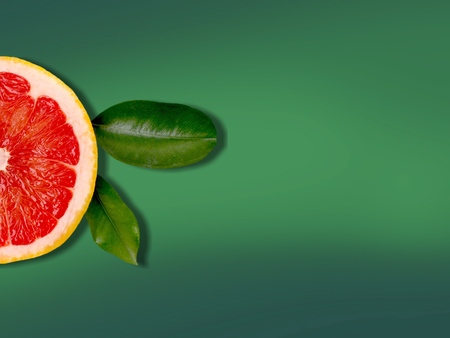 Grapefruit on green background.