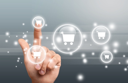 Business man pressing shopping cart icon