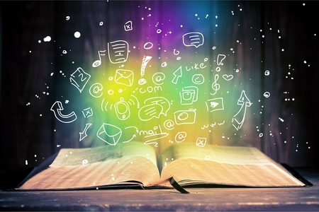 Open book on old wooden tableの写真素材