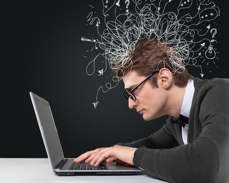 young man working on laptopの写真素材