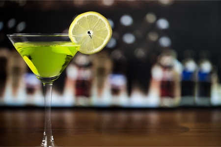 Martini cocktail in glass on blurred backgroundの写真素材