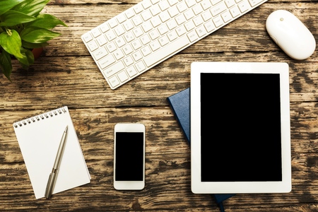 Workplace with tablet and keyboard.