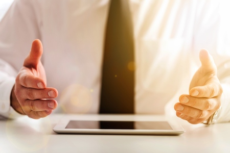 Business hand showing  tablet.の写真素材