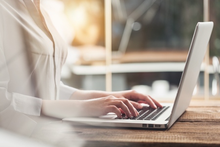 Woman typing computer with fast moving omnichannel business concept: Multi channel banking payment...