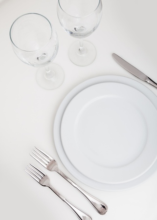 Table Setting with Plate, Forks, Knife and Glassesの写真素材