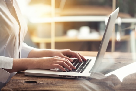 Woman typing computer with fast moving omnichannel business concept: Multi channel banking payment communication network digital technology internet wireless application development mobile smart appsの写真素材
