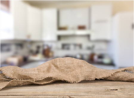 Wooden table on defocuced window with curtain backgroundの写真素材