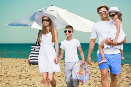 Happy beautiful family on a Caribbean holiday vacationの写真素材