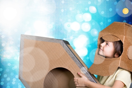 child is dressed in an astronaut costumeの写真素材