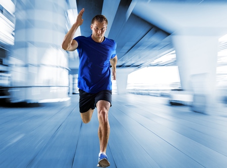 one caucasian man young sprinter runner running  in silhouette studio  on white backgroundの写真素材