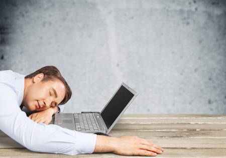 Businessman Asleep at His Desk