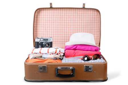 Suitcase with clothes and other travel accessories