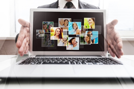 technology, internet, tv and news concept - man hands with virtual screensの写真素材