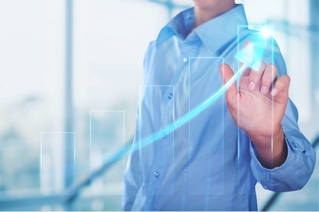 businessman hand drawing virtual chart business on touch screen computerの写真素材