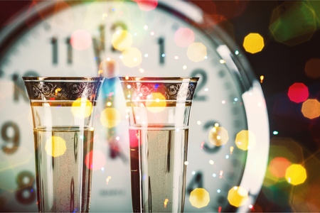 Champagne Glasses with Clock Close to Midnight