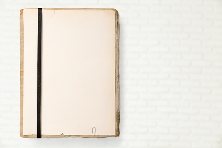 old notebook with space to insert text on a white backgroundの写真素材