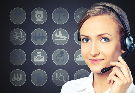 Happy support phone operator in headset at workplaceの写真素材