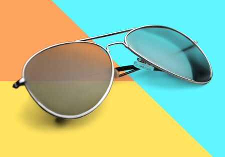 Fashionable sunglasses on minimal colorful background