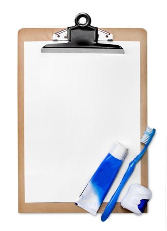 Clipboard with Blank Paper and Toothpaste, Toothbrush and Dental Floss - Isolatedの写真素材