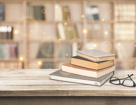 Stack book and glasses in library