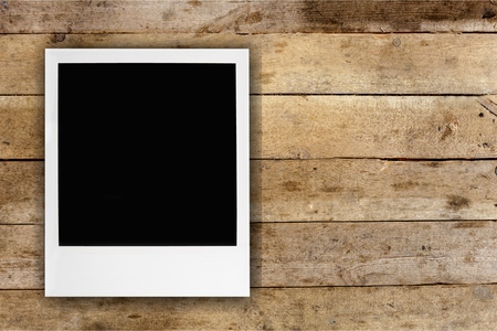 photo cards on wooden background.