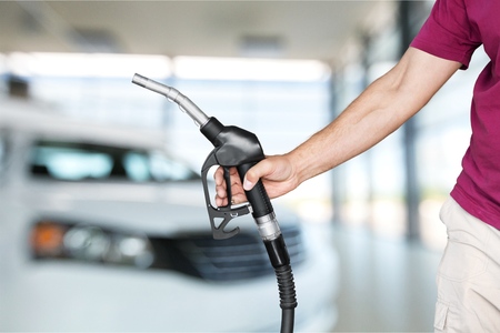holding a gas nozzle